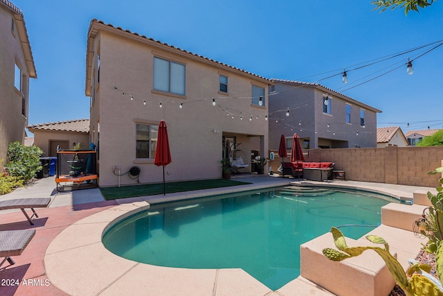 view of swimming pool featuring a fenced in pool, a patio area, and fence