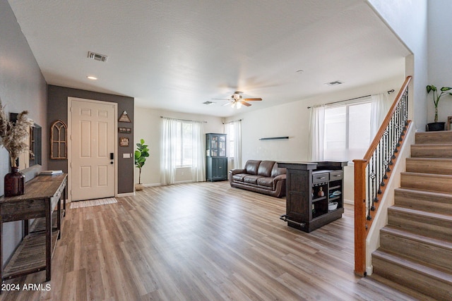 entrance foyer featuring light wood-type flooring and ceiling fan