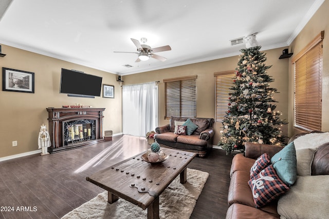 living room featuring crown molding, dark hardwood / wood-style flooring, and ceiling fan