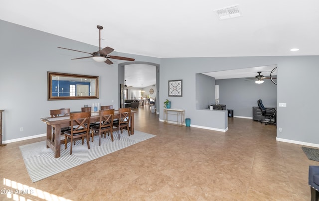 dining room with ceiling fan and lofted ceiling