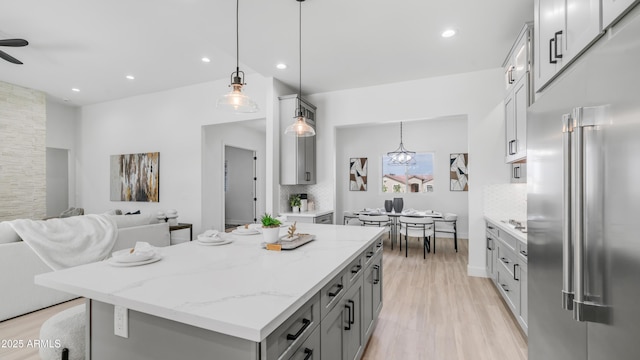 25916 S 198th St, Queen Creek, AZ 85142 - kitchen with gray cabinetry, light wood-type flooring, open floor plan, and high end refrigerator