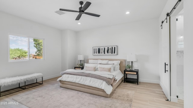 25916 S 198th St, Queen Creek, AZ 85142 - bedroom featuring a barn door, baseboards, and wood finished floors