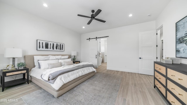 25916 S 198th St, Queen Creek, AZ 85142 - bedroom featuring a barn door, recessed lighting, light wood finished floors, a ceiling fan, and baseboards