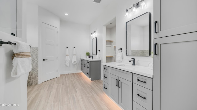 25916 S 198th St, Queen Creek, AZ 85142 - full bathroom with recessed lighting, wood finished floors, two vanities, and a sink