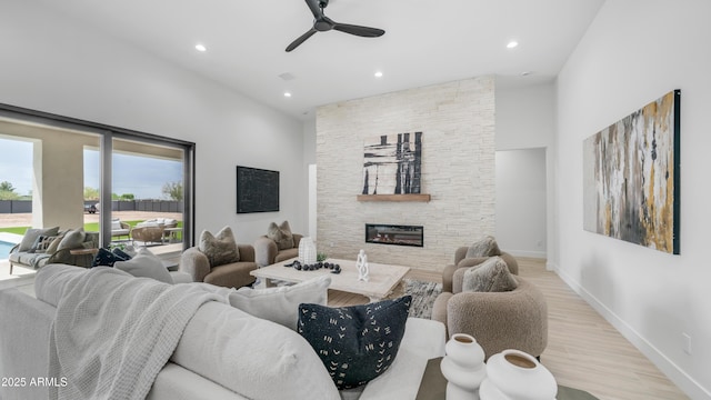 25916 S 198th St, Queen Creek, AZ 85142 - living area featuring recessed lighting, a stone fireplace, a ceiling fan, and wood finished floors
