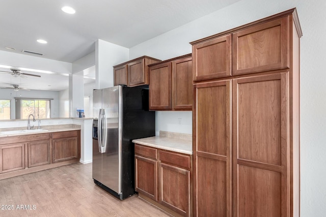 26058 W Yukon Dr, Buckeye, AZ 85396 - kitchen with stainless steel refrigerator with ice dispenser, a sink, ceiling fan, light countertops, and recessed lighting