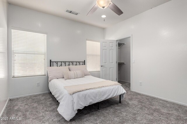 26058 W Yukon Dr, Buckeye, AZ 85396 - bedroom featuring carpet, baseboards, a ceiling fan, and a spacious closet