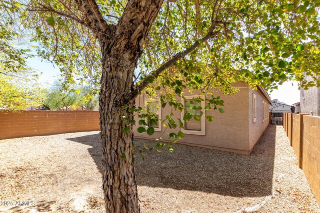 26058 W Yukon Dr, Buckeye, AZ 85396 - unfurnished bedroom featuring carpet, baseboards, a closet, and ceiling fan