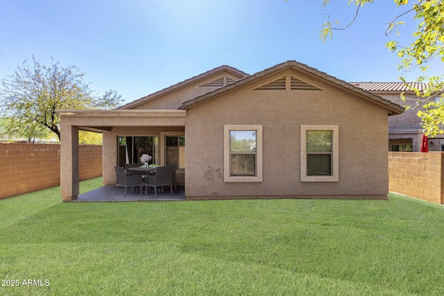 26058 W Yukon Dr, Buckeye, AZ 85396 - back of property with a patio and stucco siding