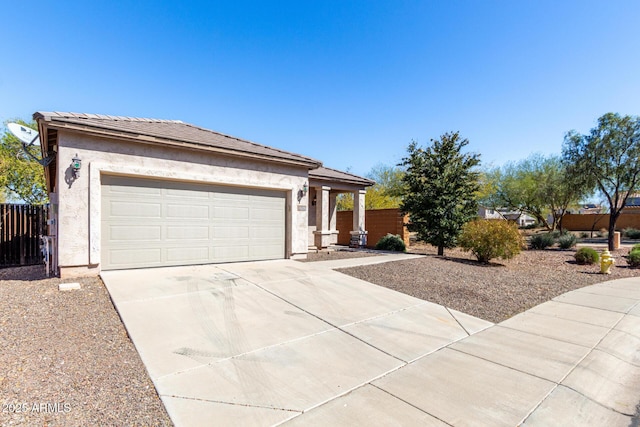 26058 W Yukon Dr, Buckeye, AZ 85396 - view of front facade with concrete driveway, fence, and stucco siding