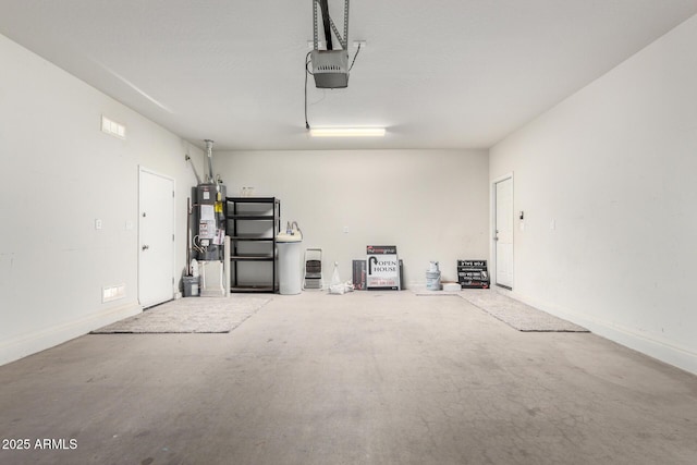 26058 W Yukon Dr, Buckeye, AZ 85396 - garage featuring water heater and a garage door opener
