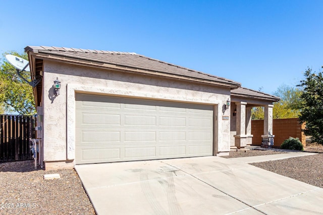 26058 W Yukon Dr, Buckeye, AZ 85396 - view of front of home with stucco siding, fence, concrete driveway, and an attached garage
