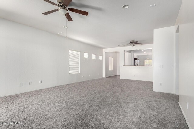 26058 W Yukon Dr, Buckeye, AZ 85396 - unfurnished living room with a ceiling fan and carpet flooring
