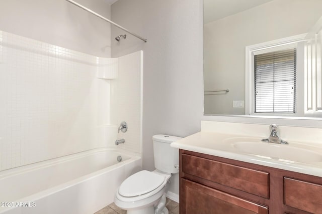 full bathroom featuring washtub / shower combination, toilet, vanity, and tile patterned flooring