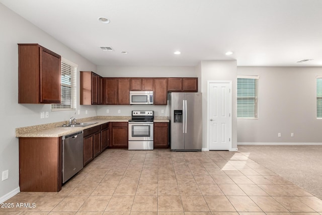 kitchen featuring visible vents, a sink, recessed lighting, appliances with stainless steel finishes, and light countertops