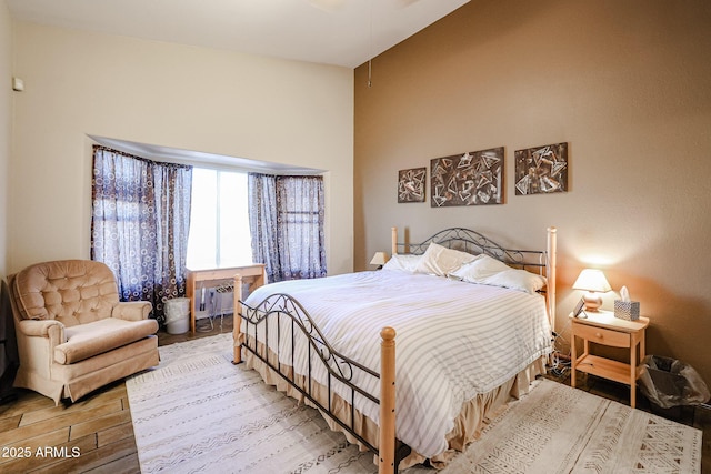 bedroom with hardwood / wood-style flooring