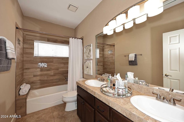 full bathroom featuring tile patterned flooring, shower / tub combo, vanity, and toilet