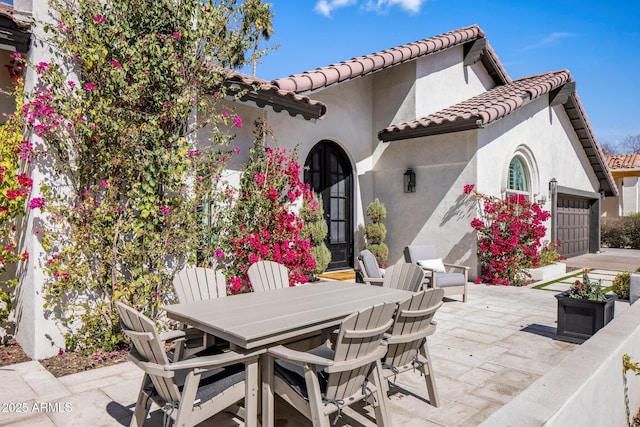 view of patio featuring outdoor dining area