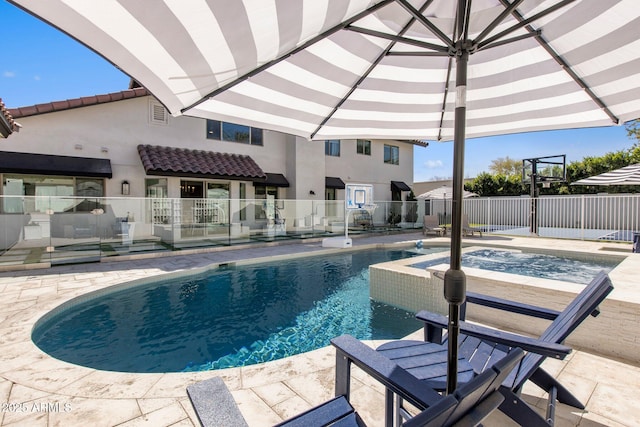 view of swimming pool featuring a patio area, a fenced in pool, an in ground hot tub, and fence