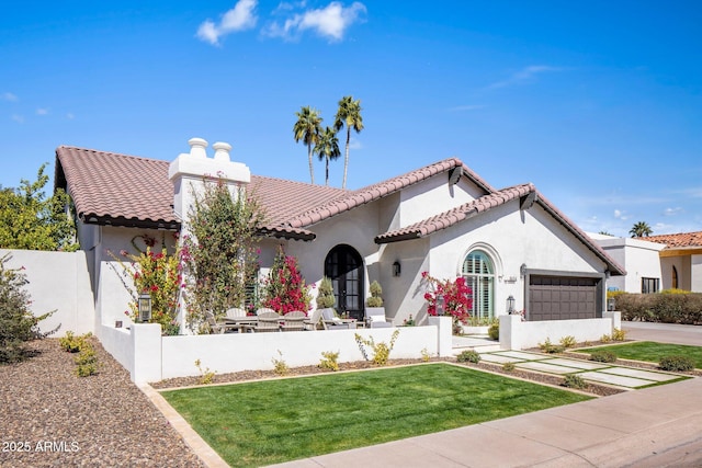 mediterranean / spanish-style home with a tiled roof, a garage, and stucco siding