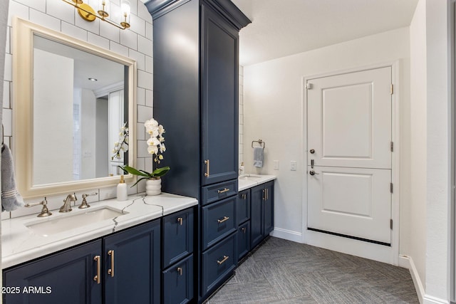 bathroom with vanity and baseboards