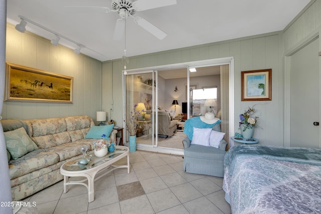 living room with ceiling fan, light tile patterned floors, and track lighting