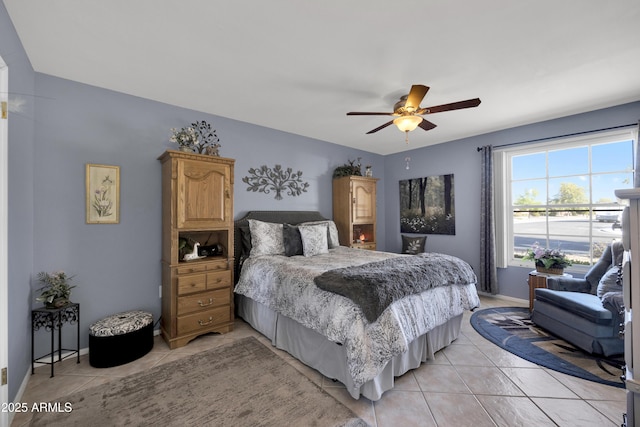 bedroom featuring ceiling fan and light tile patterned floors