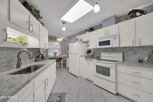 kitchen featuring white cabinetry, white appliances, sink, and hanging light fixtures