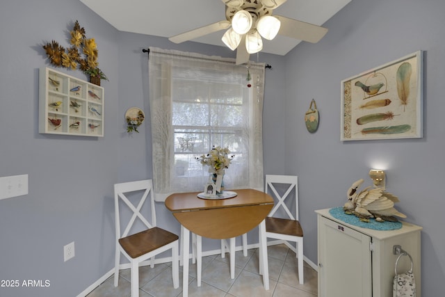 tiled dining area featuring ceiling fan