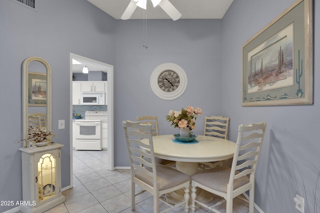 dining room with ceiling fan and light tile patterned flooring