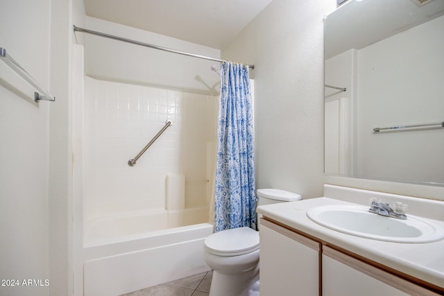 full bathroom with tile patterned floors, vanity, shower / bath combo, and toilet