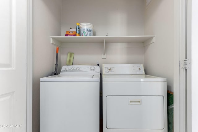 clothes washing area featuring washing machine and clothes dryer