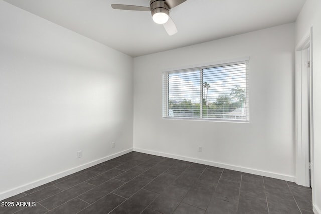 empty room with baseboards and a ceiling fan