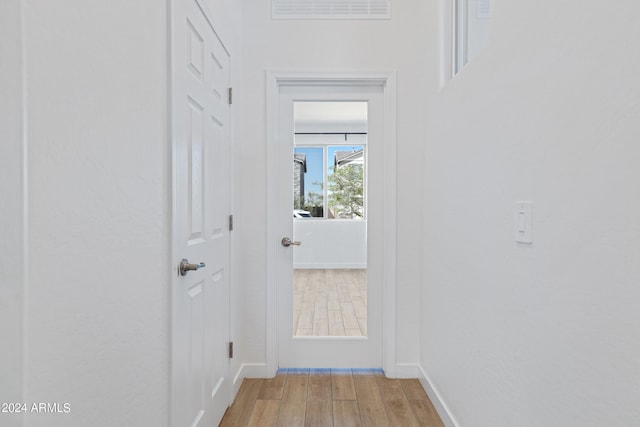 hallway with light wood-type flooring