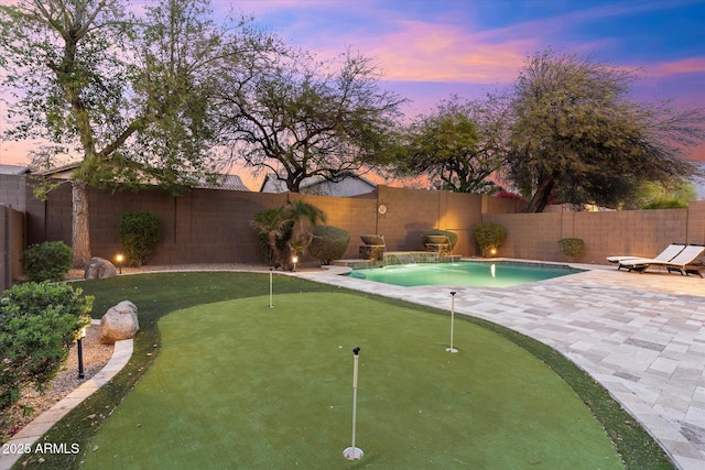 view of pool with a fenced backyard and a patio