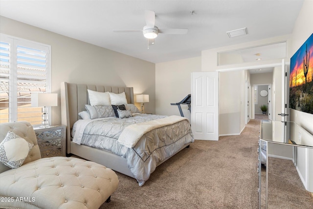 bedroom with a ceiling fan, baseboards, and light carpet