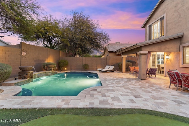 view of swimming pool with a fenced in pool, a patio, a fenced backyard, and outdoor dining space