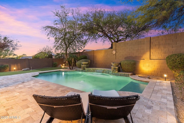 view of pool with a fenced in pool, a patio, and a fenced backyard