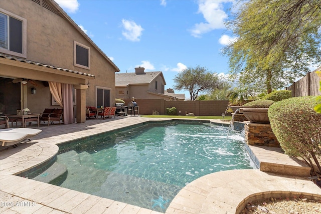 view of swimming pool featuring a fenced in pool, a fenced backyard, and a patio area