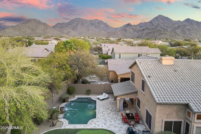 birds eye view of property with a mountain view