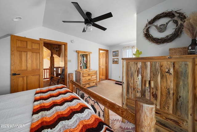 bedroom with ceiling fan, baseboards, carpet, and lofted ceiling