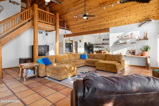 tiled living room with high vaulted ceiling, wood ceiling, baseboards, and ceiling fan