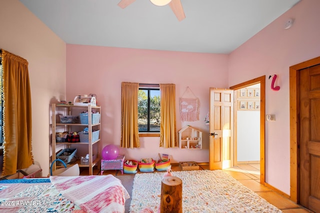 bedroom with light tile patterned floors and ceiling fan