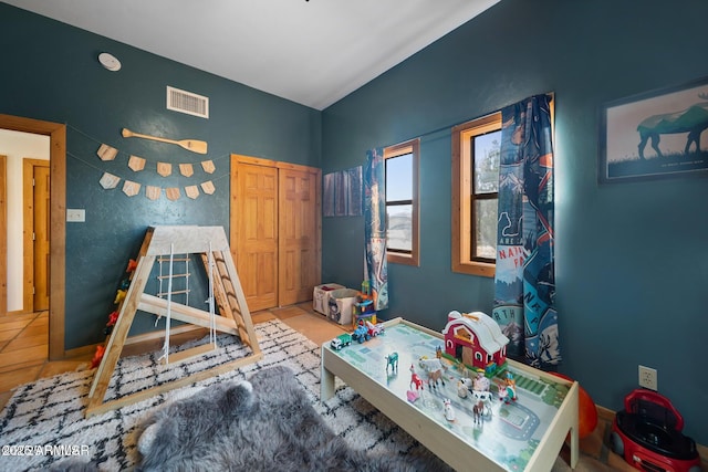game room featuring visible vents