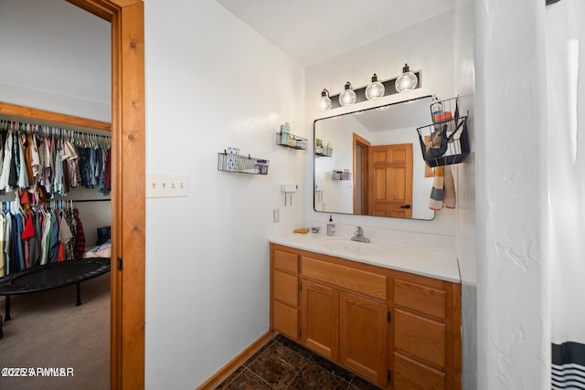 full bathroom with baseboards and vanity