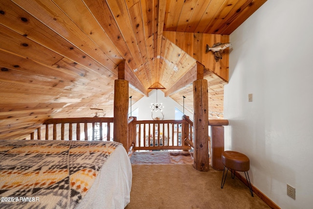 bedroom with carpet flooring, vaulted ceiling, and wood ceiling