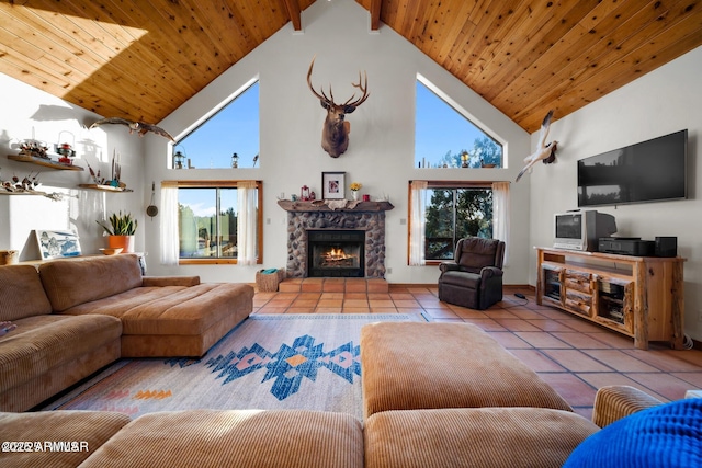 tiled living room with a wealth of natural light, high vaulted ceiling, wooden ceiling, and a fireplace