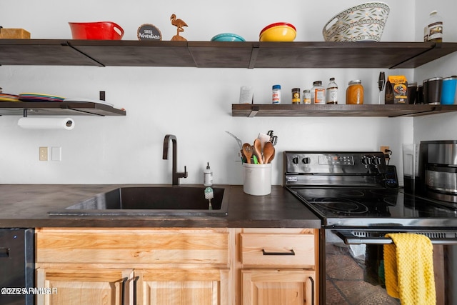 kitchen featuring dark countertops, black electric range, open shelves, and a sink