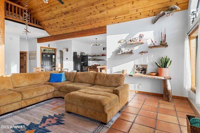 living room with light tile patterned floors, baseboards, wooden ceiling, and vaulted ceiling