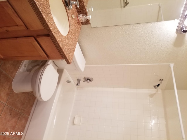 full bathroom featuring tile patterned flooring and a shower